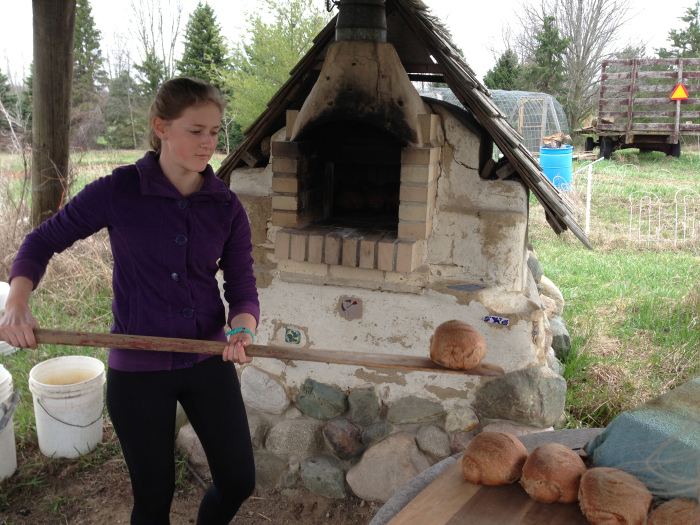 Annika unloads a loaf that she helped make!